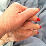 caregiver and senior citizen hands