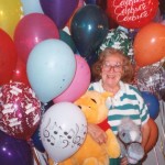 elderly woman with 75 balloons