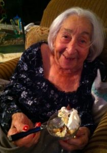 elderly woman with dessert shooter